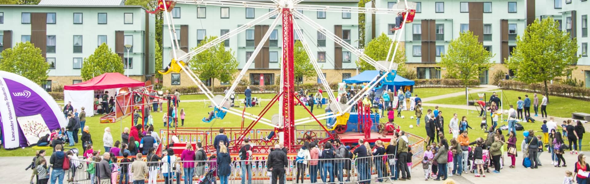 A photo of a Ferris wheel in Lancaster Square during a Family Open Day.