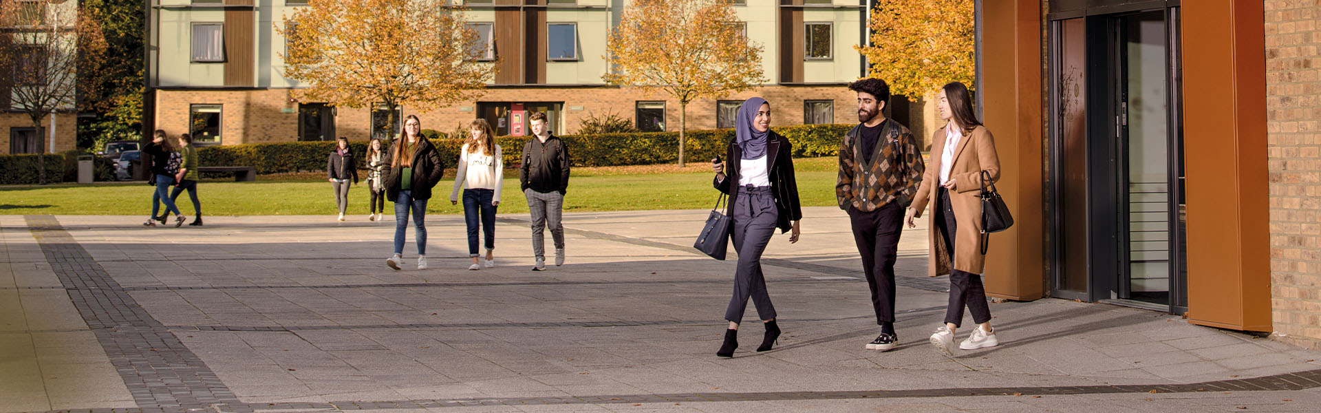 Students in a group in Lancaster Square on a sunny day.